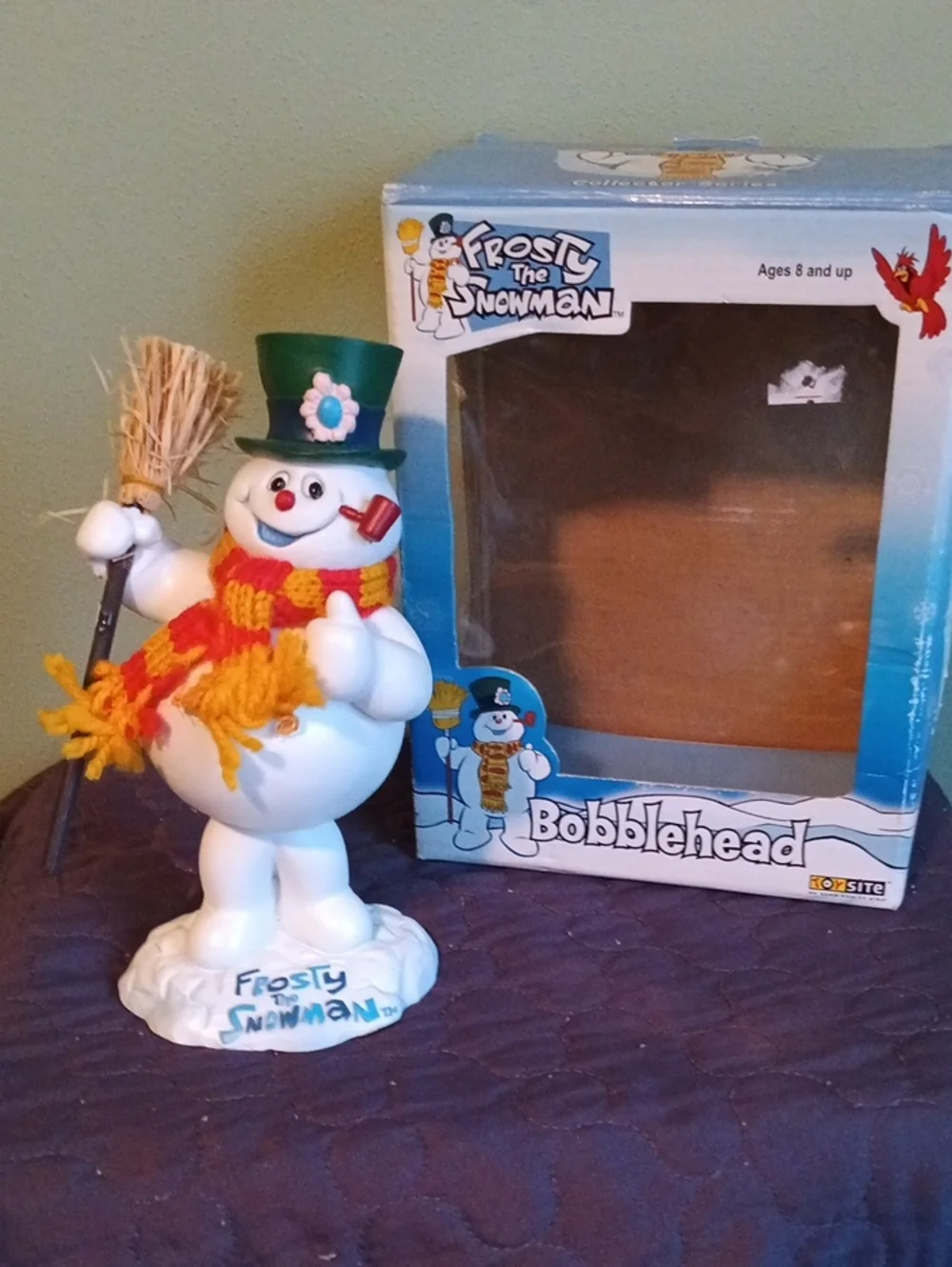 Frosty the Snowman Bobble Figurine with Green Top Hat and Yellow-Orange Scarf